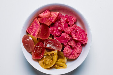 a bowl of pickled vegetables, traditional Romanian style.