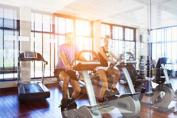 Healthy couple training on a treadmill