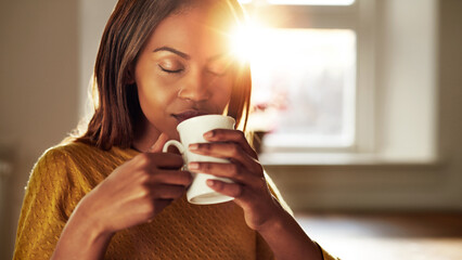 Attractive woman enjoying a cup of fresh coffee