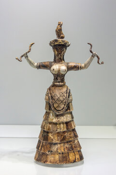 The Minoan figurine of younger Snake Goddess from the palace of Knossos. July 03, 2019. Heraklion Archaeological Museum, Crete, Greece