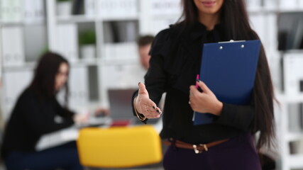 Woman hold document pad give arm as hello in office closeup. Friend welcome mediation offer positive introduction thanks gesture summit participate approval motivation male arm strike bargain