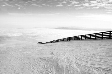 ski slope above the fog
