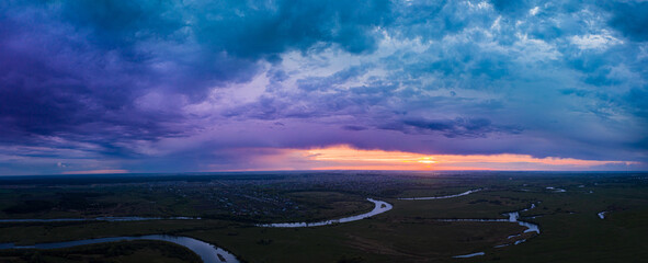 Sunset above river. evenig Panorama Aerial View Green forest And River Landscape. Top View Of...