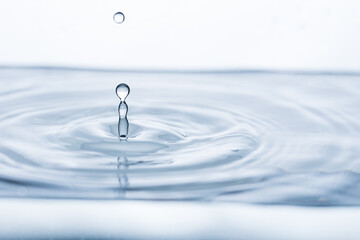 Captivating water droplet in motion, creating ripples of purity. Perfect for banners promoting...