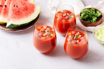 Spanish tomato and watermelon gazpacho cold soup styled and decorated in glasses