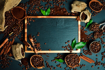 Set of coffee beans and ground coffee on black stone background, free space for text. The concept...