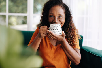 Senior woman enjoying a cup of coffee and a relaxed lifestyle after retirement