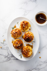 Homemade cheese buns with rosemary and gravy