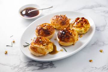 Homemade cheese buns with rosemary and gravy