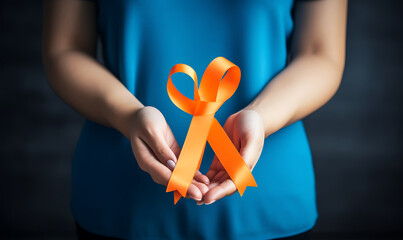 Woman with blue cloth Hand holding orange ribbon, concept of World Cancer Day, healthcare high detail  AI Image generative - Powered by Adobe