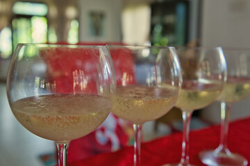 closeup prosecco sparkling wine in glasses during festive season