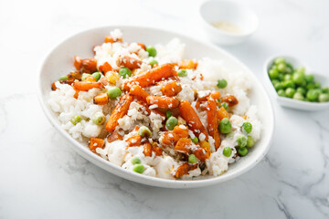 Rice bowl with carrot and pea