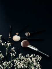 Obraz na płótnie Canvas Makeup brushes on a black background