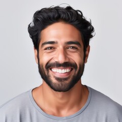 Obraz premium Charming Indian Man with a Warm, Genuine Smile. Against Neutral Background