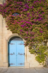 Fototapeta na wymiar Old wooden blue door in downtown of Mdina, Malta