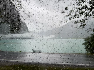Gordijnen View from inside a motorhome camper on a rainy day in the Briksdal Glacier Valley, Norway. © Alberto Gonzalez 