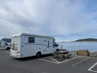 Fotobehang Motorhome camper in Alesund city parking in south Norway. Europe © Alberto Gonzalez 