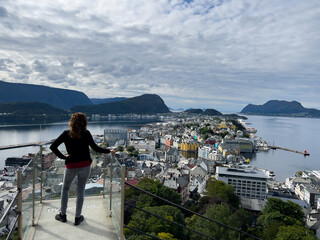 Young woman in Alesund city from view point, Norway, Europe - obrazy, fototapety, plakaty
