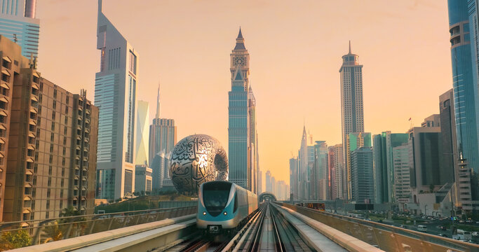 Dubai, UAE, United Arab Emirates. Monorail POV Subway train rides among skyscrapers, Museum of the Future in Dubai. Dubai, UAE, United Arab Emirates. Monorail POV Subway train rides among skyscrapers