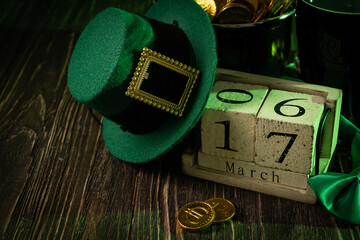 St Partick's day concept - beer, pot of gold, calendar, hat