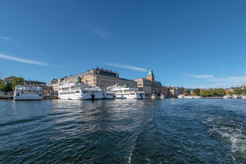 Fototapeta na wymiar Sweden Stockholm view of Norrmalm district with Taxi and Tour Boats on a sunny day
