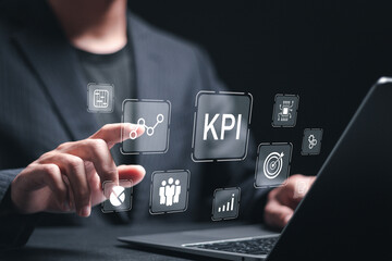 KPI Business analytics. Businessman use laptop with virtual screen of data analytics report and key performance indicators on information dashboard for business strategy and business intelligence.