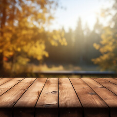 Naklejka na ściany i meble Empty natural wooden table for displaying products with blurred background of autumn forest. background of autumn scenery Collection of autumn nature and product advertising