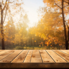 Naklejka na ściany i meble Empty natural wooden table for displaying products with blurred background of autumn forest. background of autumn scenery Collection of autumn nature and product advertising