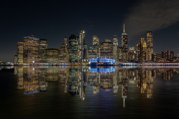 view of the New York skyline at night with reflections, skyline cities. New York.