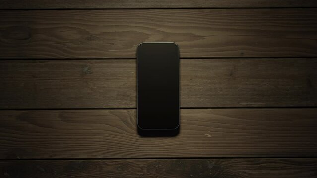 The phone falls on a wooden surface creating gravitational and sound waves