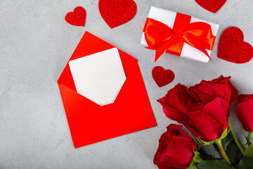 Valentine's Day concept. Valentine's Day background. Gifts, confetti, envelope - postcard, on a marble background. Flatley, top view.