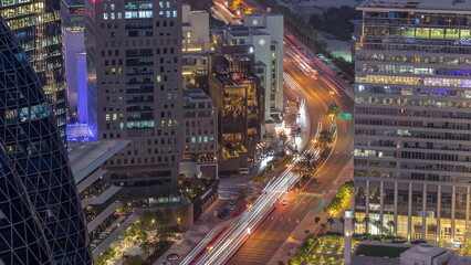 Aerial view of traffic on Al Saada street in financial district day to night timelapse in Dubai, UAE.