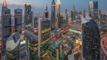Skyline view of the high-rise buildings on Sheikh Zayed Road in Dubai aerial day to night...