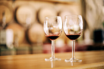 Two glasses of red wine on wooden table