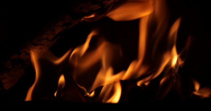 close-up wood fire with sound. fireplace wood fire close-up. spark in the wood fire. relaxing fireplace fire background with sound