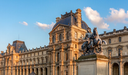 Louis XIV statue in Louvre palace courtyard, Paris, France - obrazy, fototapety, plakaty