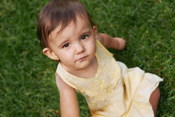 Cute, grass and portrait of girl baby having fun and playing in backyard, park or garden. Nature,...
