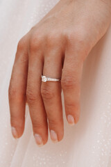 RIng wedding on white dress