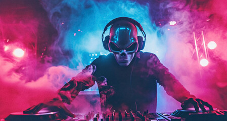 man with alien mask standing and making musical mix with special equipment and working as dj in night club at party