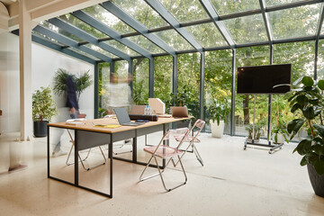 long exposure photo of young colleagues posing in motion while working in their office on startup
