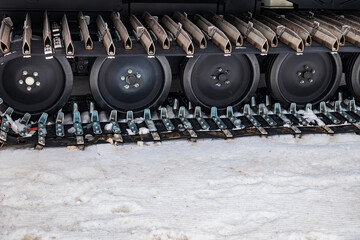 caterpillar of a snow plow. tracked vehicle in close up. close-up of the wheels of a snow plow....