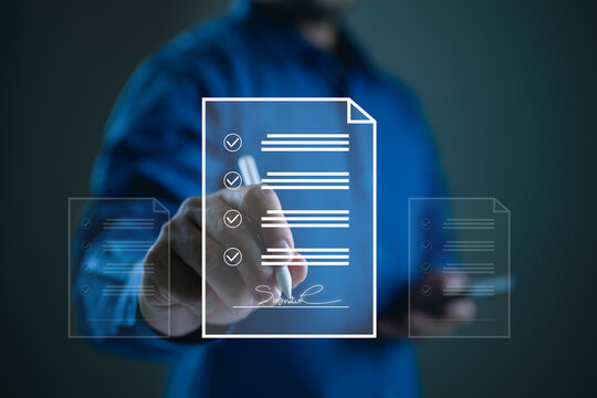 E-signing, electronic signature, document management, paperless office. Businessman signing on e document on digital tablet, virtual notepad on virtual screen, Online contract signing with application