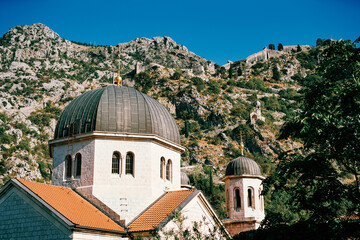 Fototapeta na wymiar Dome and bell tower of the Church of St. Nicholas. Kotor, Montenegro