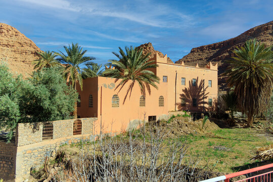 Aoufous, Morocco. Traditional muddy houses by palm oasis around river Ziz.