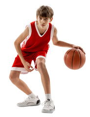 Teenagers in Sports. Full length snapshot of boy in red uniform playing basketball against transparent background. Concept of sport, hobby, energy, active lifestyle, movement, action. - obrazy, fototapety, plakaty