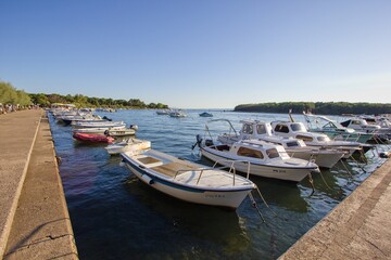Fototapeta na wymiar Small boats in port (harbor) in Punat, Krk island, Croatia