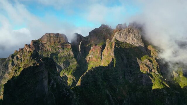 Hovering above Madeira's dramatic scenery, the drone video highlights the dance between light and mist over the jagged cliffs, painting a picture of nature's powerful elegance