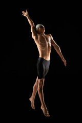 Full-length image of muscular young man, professional swimmer with muscular relief body shape...