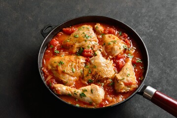Georgian chicken stew with tomatoes and herbs - obrazy, fototapety, plakaty