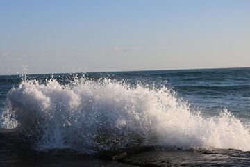 Fototapeta premium white-crested waves splashing in the water